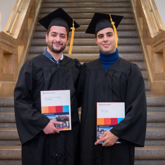 theo visvikis (r) and stefanos_zoidis in their graduation gowns