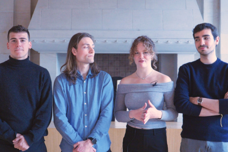 Jonas, Rufus, Nicole and Tomas standing in a moot court